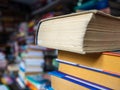 Books with the turned yellow pages stand the friend on the friend in a heap. The shelf with books for sale Royalty Free Stock Photo