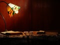 Books by a warm lamplight in study Royalty Free Stock Photo