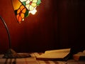 Books by a warm lamplight in study Royalty Free Stock Photo