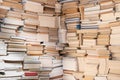 Books on wooden shelves close-up. Old files library. Background of library book shelf. Books of different thickness and color, top