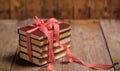 Books wrapped with color ribbon, on wooden table