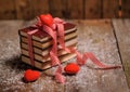 Books wrapped with color ribbon, on wooden table