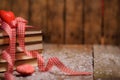 Books wrapped with color ribbon, on wooden table