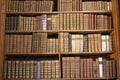 Bookshelf with antique old books in a museum Royalty Free Stock Photo