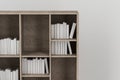 Bookshelf with books inside in the empty new house, 3d rendering