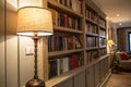 Bookshelf on the wall with lamp and books Royalty Free Stock Photo
