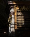 Bookshelves in the dark in old historical library Royalty Free Stock Photo