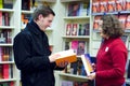 Bookshop assistant and the customer Royalty Free Stock Photo