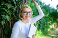 Bookworm student relaxing with book green nature background. Girl keen on book keep reading. Woman blonde take break