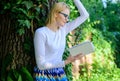 Bookworm student relaxing with book green nature background. Literature as hobby. Spend leisure with avail. Girl keen on Royalty Free Stock Photo