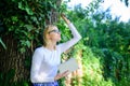 Bookworm student relaxing with book green nature background. Spend leisure with avail. Girl keen on book keep reading Royalty Free Stock Photo