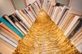 Bookworm tower built from old novels and volums of historical library. Huge installation with many vintage books