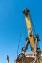 Boom and other parts of the quarry excavator close-up. Work on the territory of a mining enterprise for the extraction of sand,