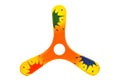 3 wings wooden boomerang painted orange, and yellow with color splash