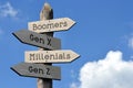 Boomers, Gen X, Millenials, Gen Z - wooden signpost with four arrows Royalty Free Stock Photo