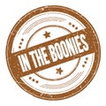 IN THE BOONIES text on brown round grungy stamp