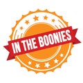 IN THE BOONIES text on red orange ribbon stamp Royalty Free Stock Photo