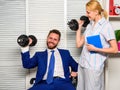 Boost business team. Boost your skill. Man and woman raise heavy dumbbells. Boost sales with strong strategy. Good job Royalty Free Stock Photo