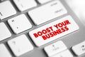 Boost Your Business text button on keyboard, concept background