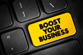 Boost Your Business text button on keyboard, concept background