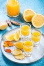 Boosting immune system - homemade healthy Ginger Lemon Turmeric Shot Royalty Free Stock Photo