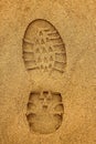Boot Footprint with crampons in wet sand Royalty Free Stock Photo
