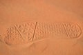Boot print on desert sand close-up view Royalty Free Stock Photo
