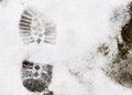 Boot print in the snow. Royalty Free Stock Photo