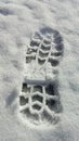 Boot print in the snow Royalty Free Stock Photo