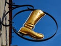 Boot shod with copper in an iron ring as a sign of a medieval shoemaker`s workshop in the old town