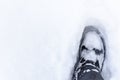 Boot in the snow. Footprint in the snow. Royalty Free Stock Photo