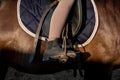 Boot in a stirrup riding a horse, Saddle with stirrups Royalty Free Stock Photo