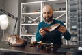 Bootmaker repairing the shoe, footwear repair