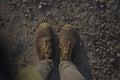 Dirty boots on a ground Royalty Free Stock Photo