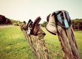 Boots on a fence