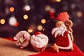 Boots filled of treats. Saint Nicholas cookies and cupcakes on bokeh background. Traditional holiday in Europe. Copy Royalty Free Stock Photo