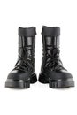 Boots for a modern grunge woman. Women\'s black boots with laces isolated on white. Black Leather Army Boots Royalty Free Stock Photo