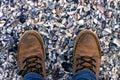 Boots on shells, view from above Royalty Free Stock Photo