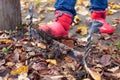 Boots on a shoe scraper. Dirty rubber boots are cleaned of dirt from the sole on the English traditional shoe scraper in Royalty Free Stock Photo