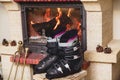 Boots ski boots in front of fireplace Royalty Free Stock Photo