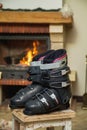 Boots ski boots in front of fireplace Royalty Free Stock Photo