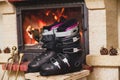 Boots ski boots in front of fireplace Royalty Free Stock Photo