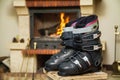 Boots ski boots in front of fireplace Royalty Free Stock Photo