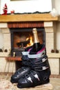 Boots ski boots in front of fireplace Royalty Free Stock Photo