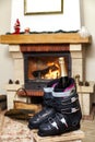 Boots ski boots in front of fireplace Royalty Free Stock Photo