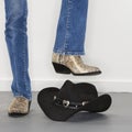 Boots stomping cowboy hat. Royalty Free Stock Photo