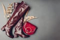 Boots, stylish burgundy reptile skin leather shoes for women with handbag. Female fashion. Footwear with purse Royalty Free Stock Photo