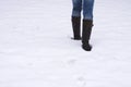 Boots trudging through snow Royalty Free Stock Photo