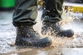 boots undergoing water-resistant test under artificial rain Royalty Free Stock Photo