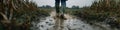 Boots Walking Through Mud in a Field: Dynamic Agricultural Work Royalty Free Stock Photo